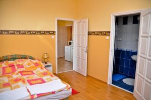 Cama ou camas em um quarto em Kastely Panzio II.