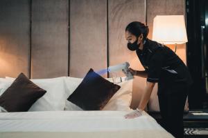 Postel nebo postele na pokoji v ubytování Le'venue Hotel