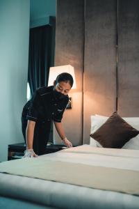 Postel nebo postele na pokoji v ubytování Le'venue Hotel
