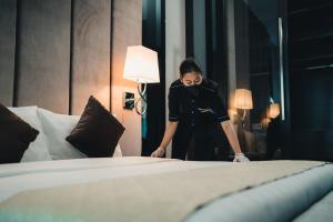 Postel nebo postele na pokoji v ubytování Le'venue Hotel