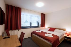 A bed or beds in a room at Vila DEDO