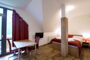 A bed or beds in a room at Vila DEDO