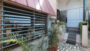 a porch with plants on the side of a house at Dreiven Residences Sta. Mesa in Manila