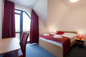 A bed or beds in a room at Vila DEDO