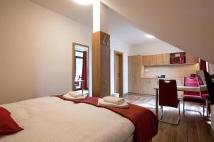 A bed or beds in a room at Vila DEDO