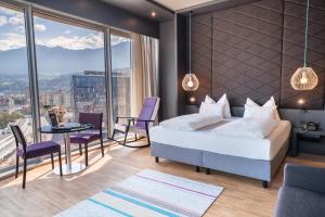 Voodi või voodid majutusasutuse aDLERS Hotel Innsbruck toas