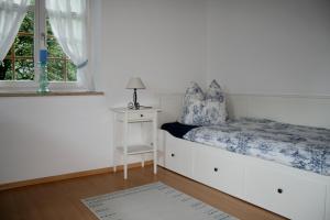 Кровать или кровати в номере Ferienwohnung zur BlauEnte