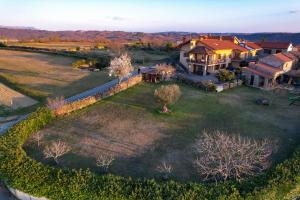 an aerial view of a house with a large yard at Apartma PANORAMA in Marezige