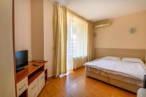 Postel nebo postele na pokoji v ubytování Apartcomplex Panorama Dreams