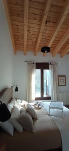 A bed or beds in a room at Molino Mellado