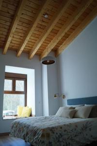 A bed or beds in a room at Molino Mellado