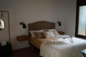 A bed or beds in a room at Molino Mellado