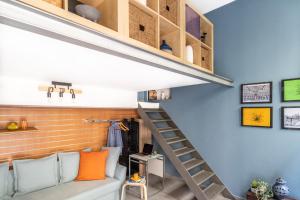 a room with a loft bed and a staircase at ALTIDO Vibrant Studio for 3 near the City Centre in Milan