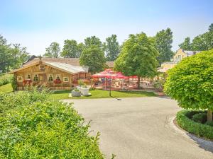 a house with a pavilion in the middle of a driveway at Gutshof Penning in Rotthalmünster