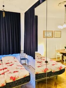 two images of a bedroom with a bed and a table at ROMANTIC studio in 12th district of Budapest, close to MOM Park in Budapest