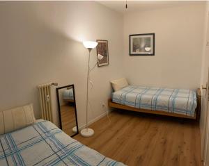 A bed or beds in a room at Holiday on the Lake Lugano 2-16