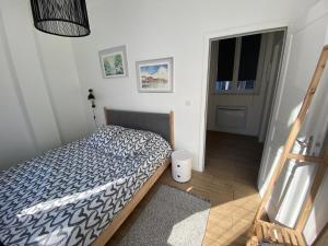 Ένα ή περισσότερα κρεβάτια σε δωμάτιο στο Appartement Rez de chaussé