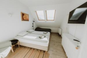 Postel nebo postele na pokoji v ubytování Casa Botár Vendégház
