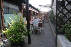 a group of people sitting at a table on a patio at Seven Stars in Ledbury