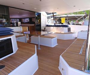 a large boat with white tables and white furniture at Marina Yacht Charter in Rosignano Solvay