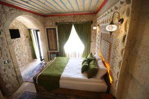 Postel nebo postele na pokoji v ubytování Akritis Cappadocia House