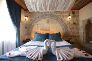 Postel nebo postele na pokoji v ubytování Akritis Cappadocia House