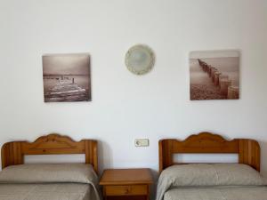 Posteľ alebo postele v izbe v ubytovaní Hostal CAN GALLU