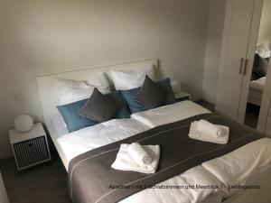 Ένα ή περισσότερα κρεβάτια σε δωμάτιο στο Ferienhaus Strandläufer