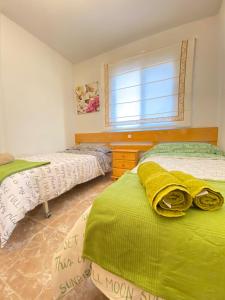 A bed or beds in a room at S&H El Caprichoso