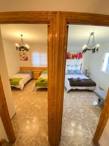 A bed or beds in a room at S&H El Caprichoso