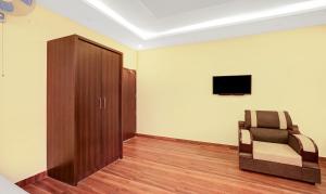 TV a/nebo společenská místnost v ubytování Treebo Doha King