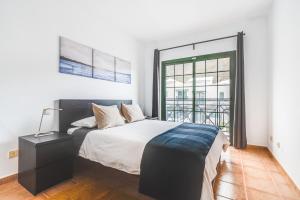 Cama o camas de una habitación en Home2Book Residencial Las Candelarias 2