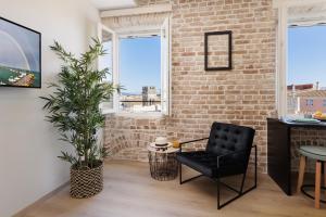 TV a/nebo společenská místnost v ubytování Vailato Loft Suites
