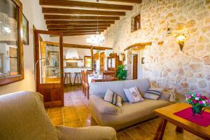 a living room with a couch and a table at Can Malanyo in Alcudia