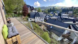 a balcony with a view of a town at Williadukt in Willingen