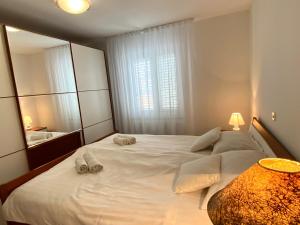 Posteľ alebo postele v izbe v ubytovaní Apartment Tina