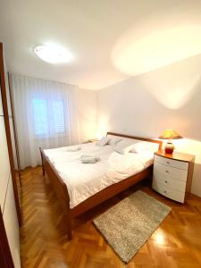 Posteľ alebo postele v izbe v ubytovaní Apartment Tina
