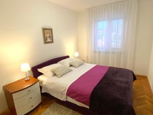 Posteľ alebo postele v izbe v ubytovaní Apartment Tina