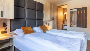 Posteľ alebo postele v izbe v ubytovaní UplandParcs Silvretta