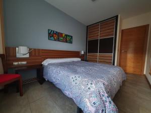 A bed or beds in a room at Playa Colina