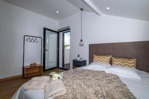 מיטה או מיטות בחדר ב-Carvão Pdl Inn