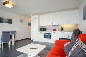 Η κουζίνα ή μικρή κουζίνα στο Haus-Zur-Mole-Wohnung-14-Meerglueck