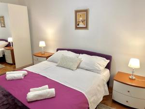 Posteľ alebo postele v izbe v ubytovaní Apartment Tina