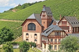 a large building with a clock tower on a hill at Ferienappartement Trier in Trier