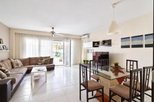 a living room with a couch and a table at CASA OASIS in Calella