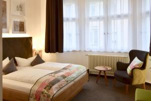Vuode tai vuoteita majoituspaikassa Stadt-Gut-Hotels - Das Kleine Hotel