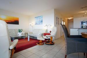 Khu vực ghế ngồi tại Haus-Ostseeapartments-am-Fehmarnsund-Wohnung-31-Beachlife