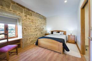 Ένα ή περισσότερα κρεβάτια σε δωμάτιο στο Casa das Eiras +47 φωτογραφίες