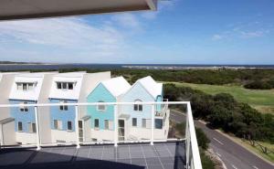 a balcony of a house with a view of the ocean at Lady Bay Resort in Warrnambool