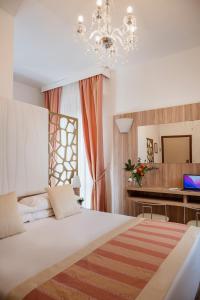 Ліжко або ліжка в номері Boutique Hotel Re Enzo